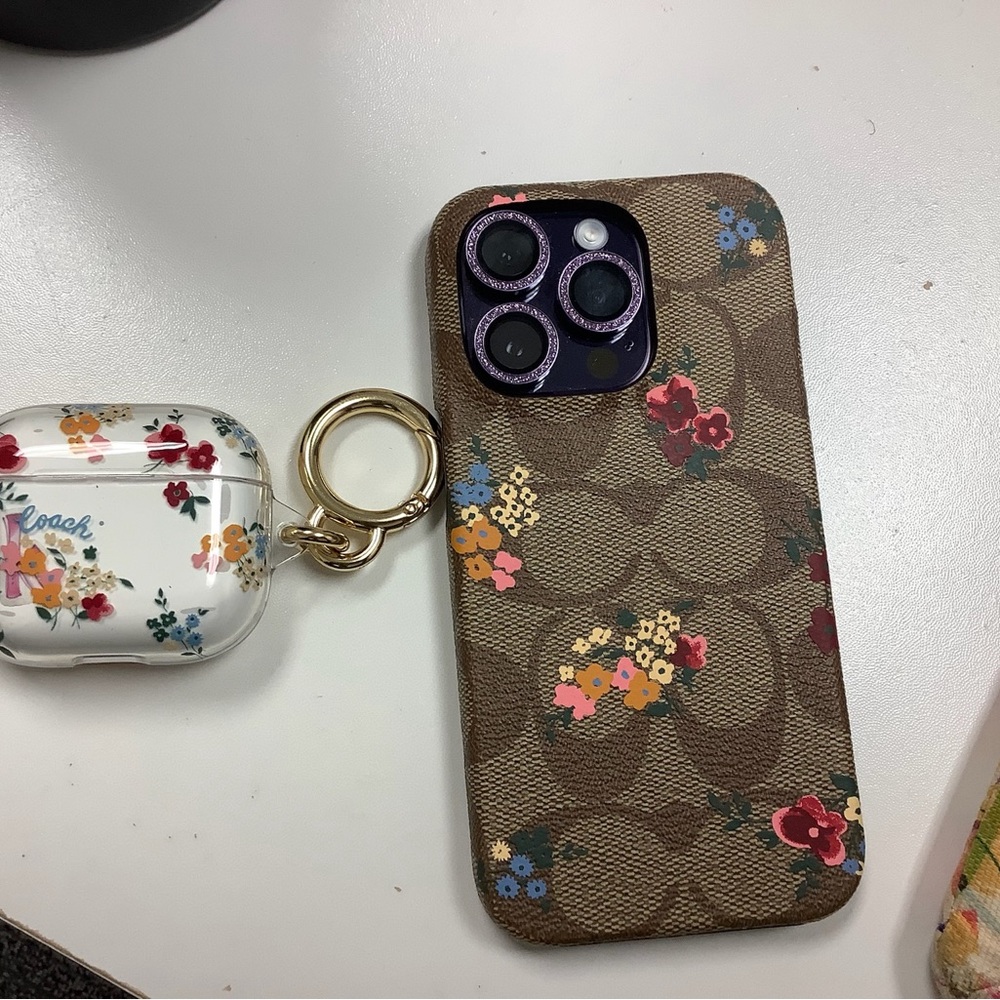 Coach signature floral print iPhone 14 Pro and AirPods 3 case
